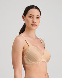 Model wears Rita Contour Bra in LATTE. On body side view