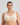 Model wears Ultimate Comfort Front Closure Wire Free Front Opening Bra in PINK CHAMPAGNE. On body front view