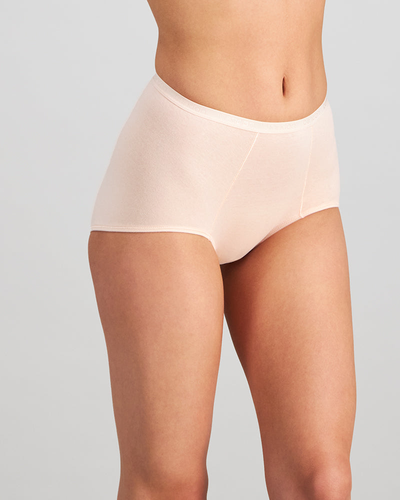 Model wears Body Cotton Full Brief Twin Pack in OXBLOOD RED/PEARL BLUSH. On body side view
