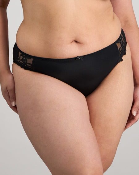 Model wears Coral High Cut Brief in BLACK. On body front view