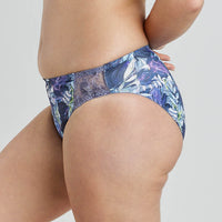 Model wears Violet Floral High Cut Brief in DARK PROTEA PRINT. On body side view