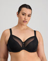 Model wears Faithful Underwire Bra in BLACK. On body front view
