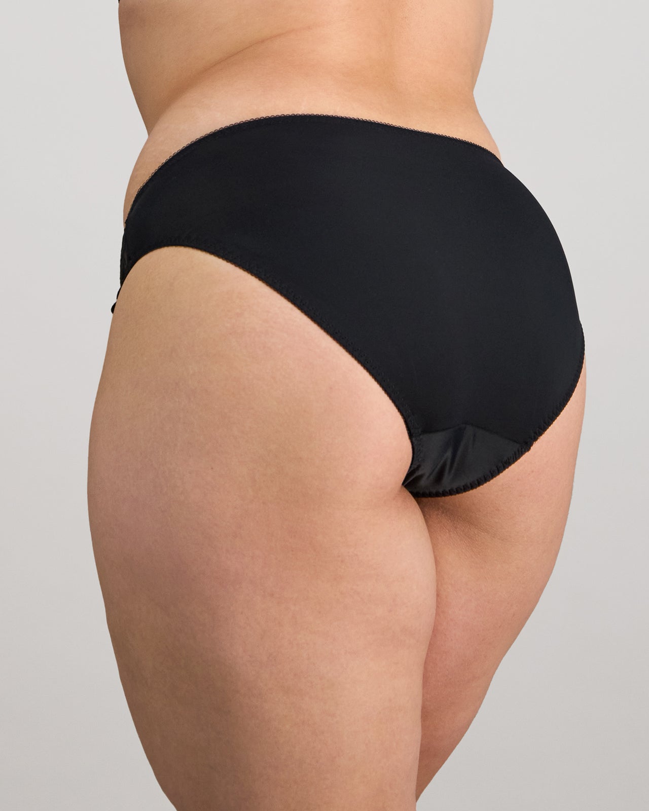 Coral High Cut Brief in BLACK. Flat lay back view