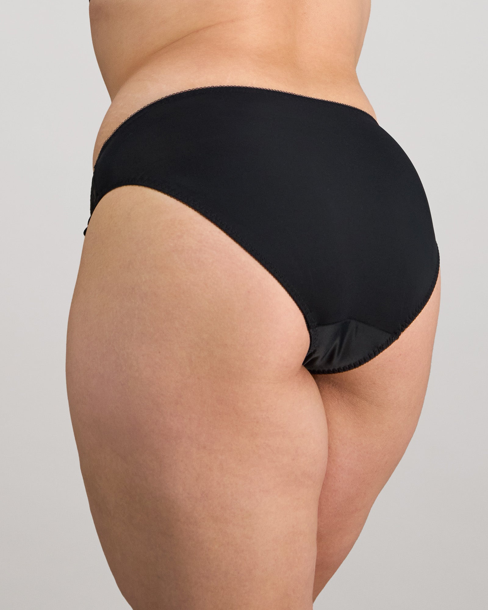 Coral High Cut Brief in BLACK. Flat lay back view