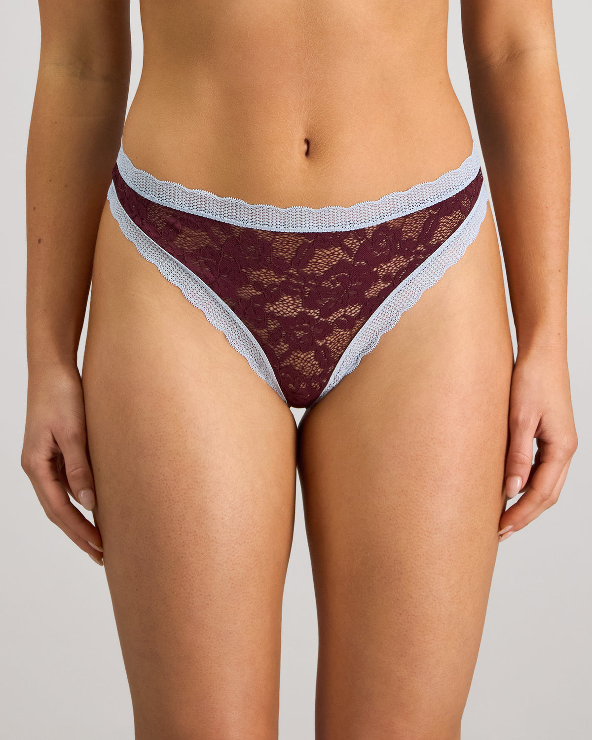 Model wears Leo Thong in FIG/SKYWAY. On body front view