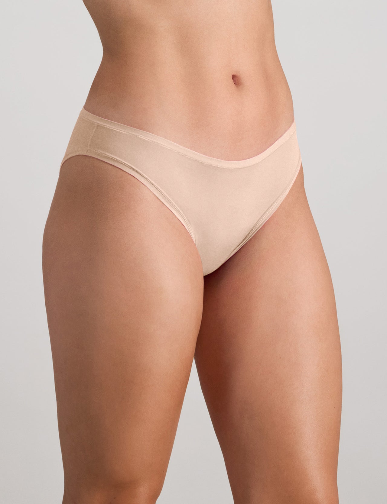 Model wears Extra-Ordinary Bikini in LATTE. On body side view