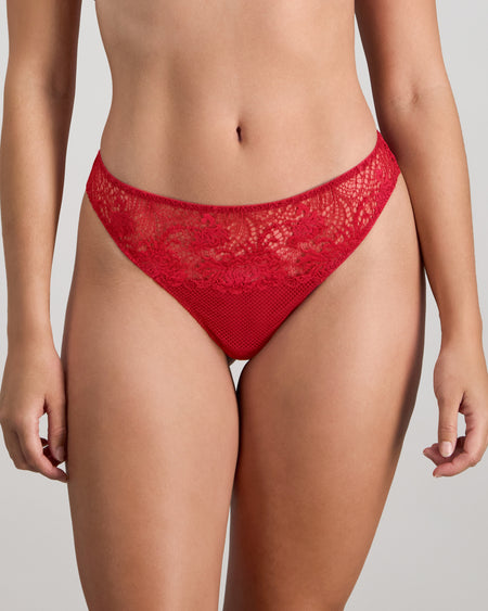 Model wears Adoration Thong in SALSA. On body front view