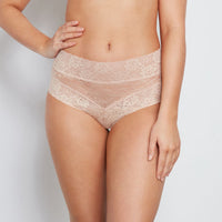 Model wears Lace Full Brief in LATTE. On body front view