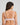 Model wears Comfit Collection Wire Free Bra in FESTIVAL BLOOM. On body back view