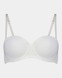 Model wears Body Basics Strapless Bra in WHITE. On body front view