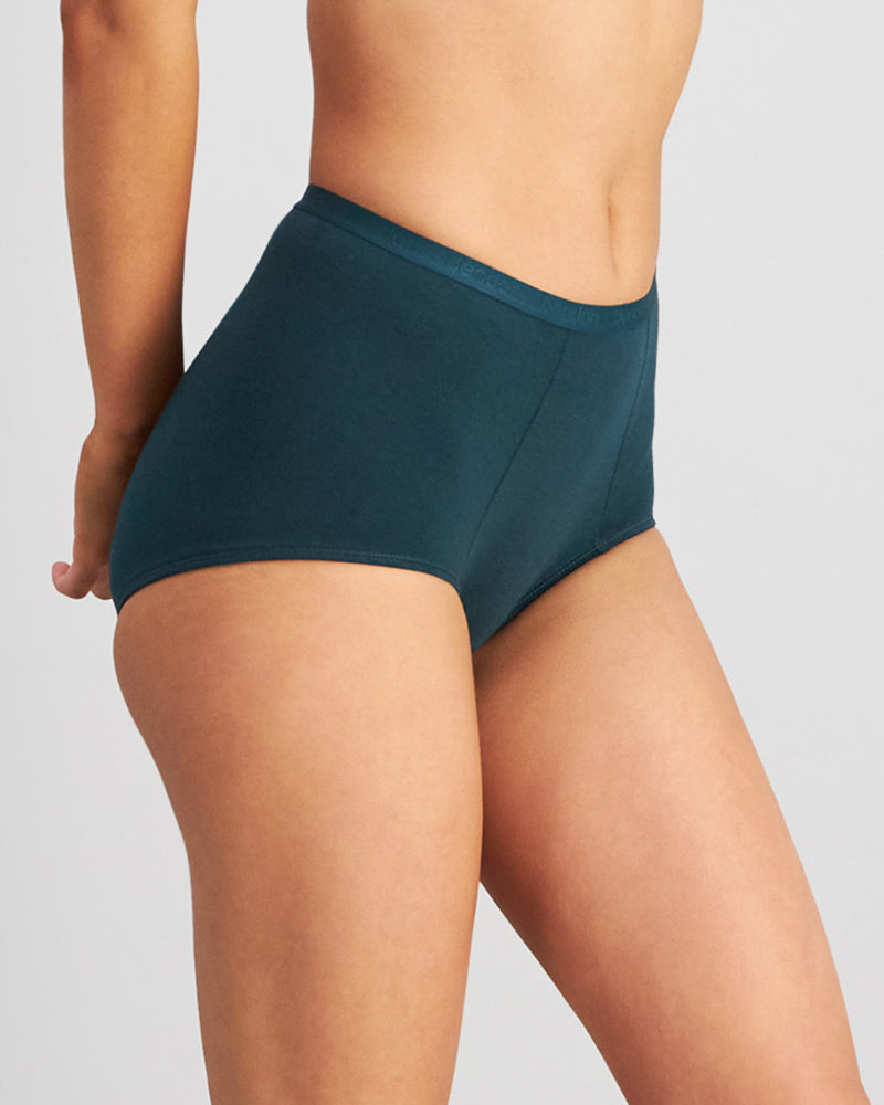 Model wears Body Cotton Full Brief in PONDEROSA PINE. On body side view