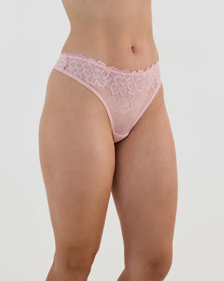 Model wears All Lacey Thong in SILVER PINK. On body side view