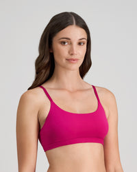 Model wears Extra-Ordinary Crop Top in FANTASY FUCHSIA. On body side view