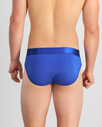 Model wears Bamboo Mens Brief in Surf The Web. On body back view