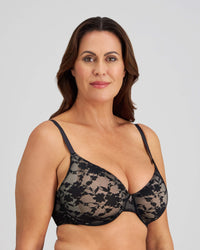 Model wears Lace Sculpt Underwire Bra in BLACK. On body side view