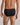 Model wears High Tech Cotton Mens Brief in BLACK. On body back view