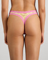 Model wears Leo Thong in LEMON/FUCHSIA PINK. On body back view