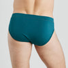 Model wears High Tech Cotton Mens Brief in DEEP TEAL. On body back view