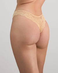 Model wears My Fit Lace Thong in FRAPPE. On body side view