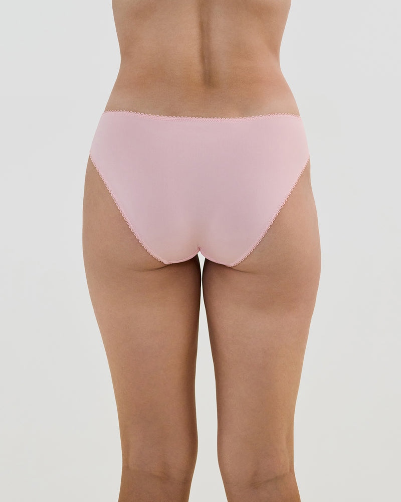 Model wears Lacey Bikini in SILVER PINK. On body back view