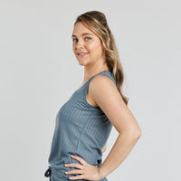 Model wears Charlene Singlet in EUCALYPTUS. On body side view