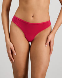 Model wears Extra-Ordinary Thong in JAZZY. On body front view