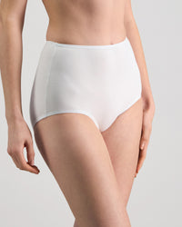Model wears Freestyle Full Brief in WHITE. On body side view