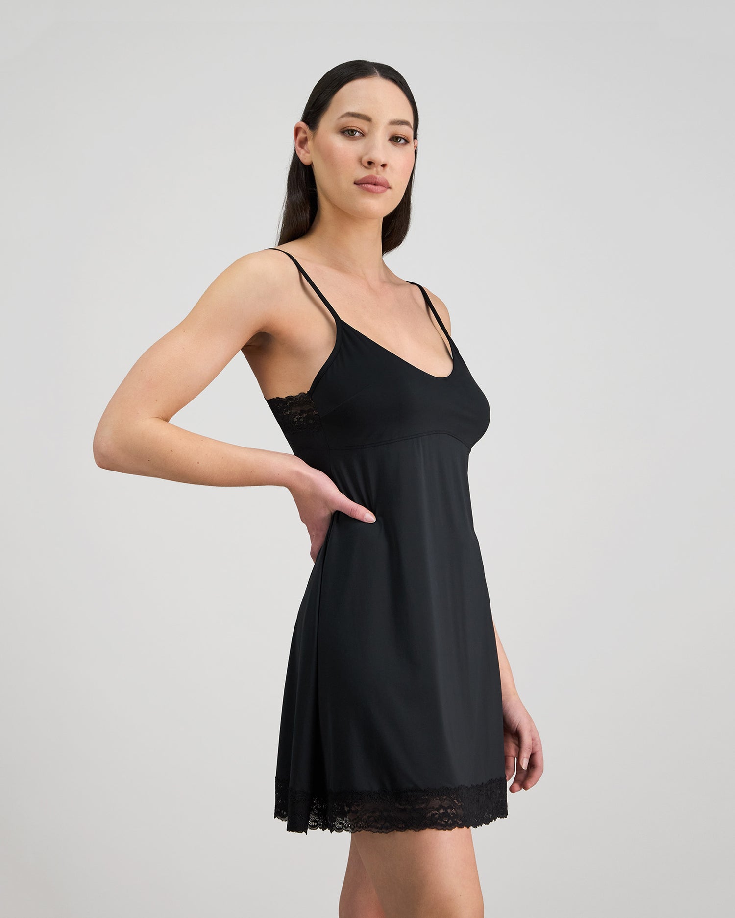 Model wears Understatement Slip in BLACK. On body side view