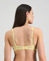 Model wears Sunlit Underwire Bra in LEMON MERINGUE. On body back view