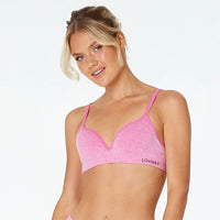 Model wears Simply Seamless Contour Bra in SHOCKING PINK MARLE. On body front view