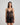 Model wears Ava Rose Babydoll in BLACK. On body front view