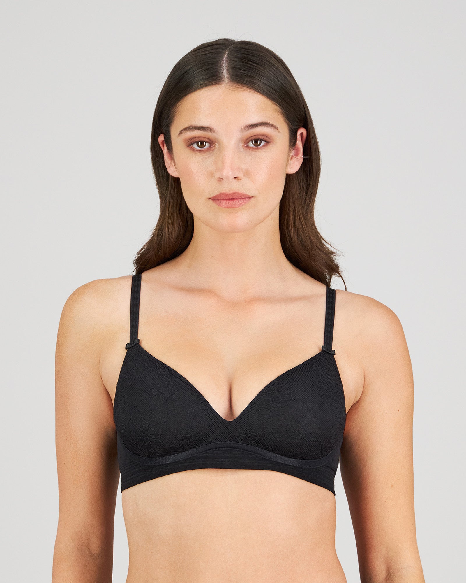 Model wears Bendon Body Lace Wire Free Bra in BLACK. On body front view