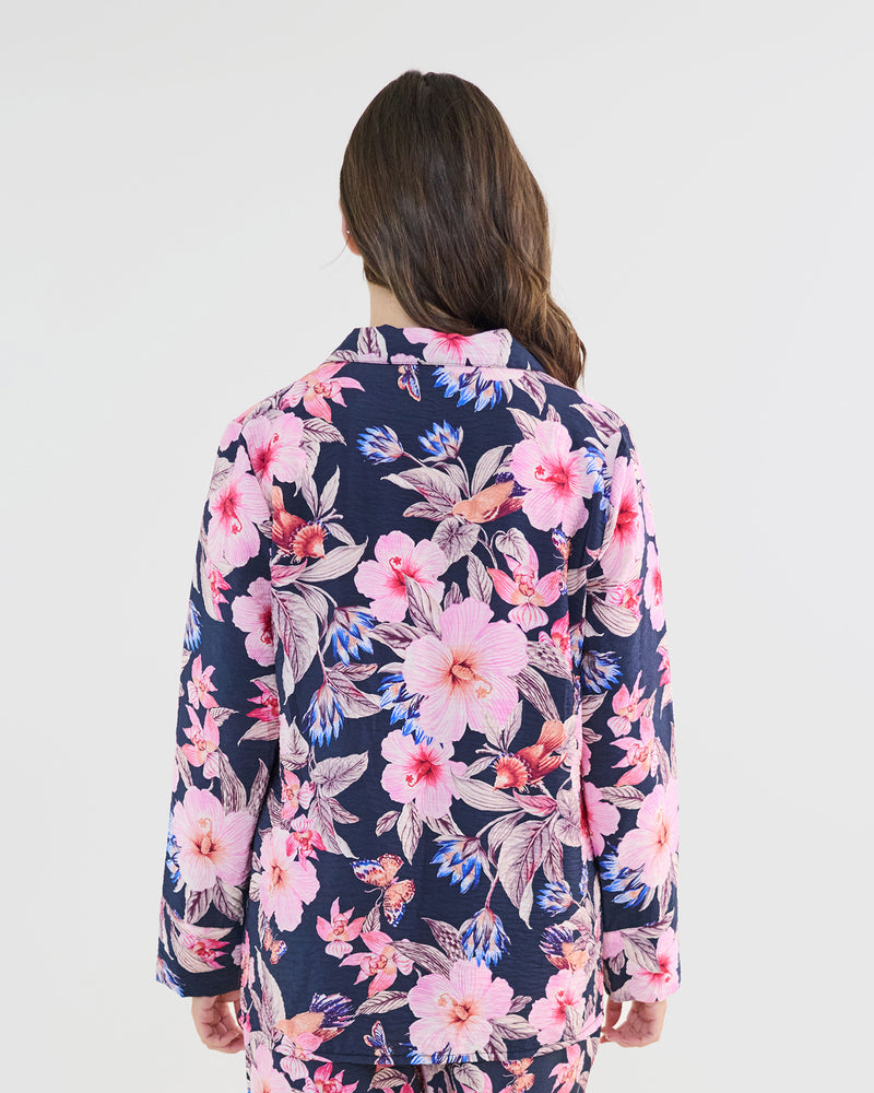 Model wears Mihika Sleeping Long Sleeve PJ Top in HONOLULU HAZE PRINT. On body back view