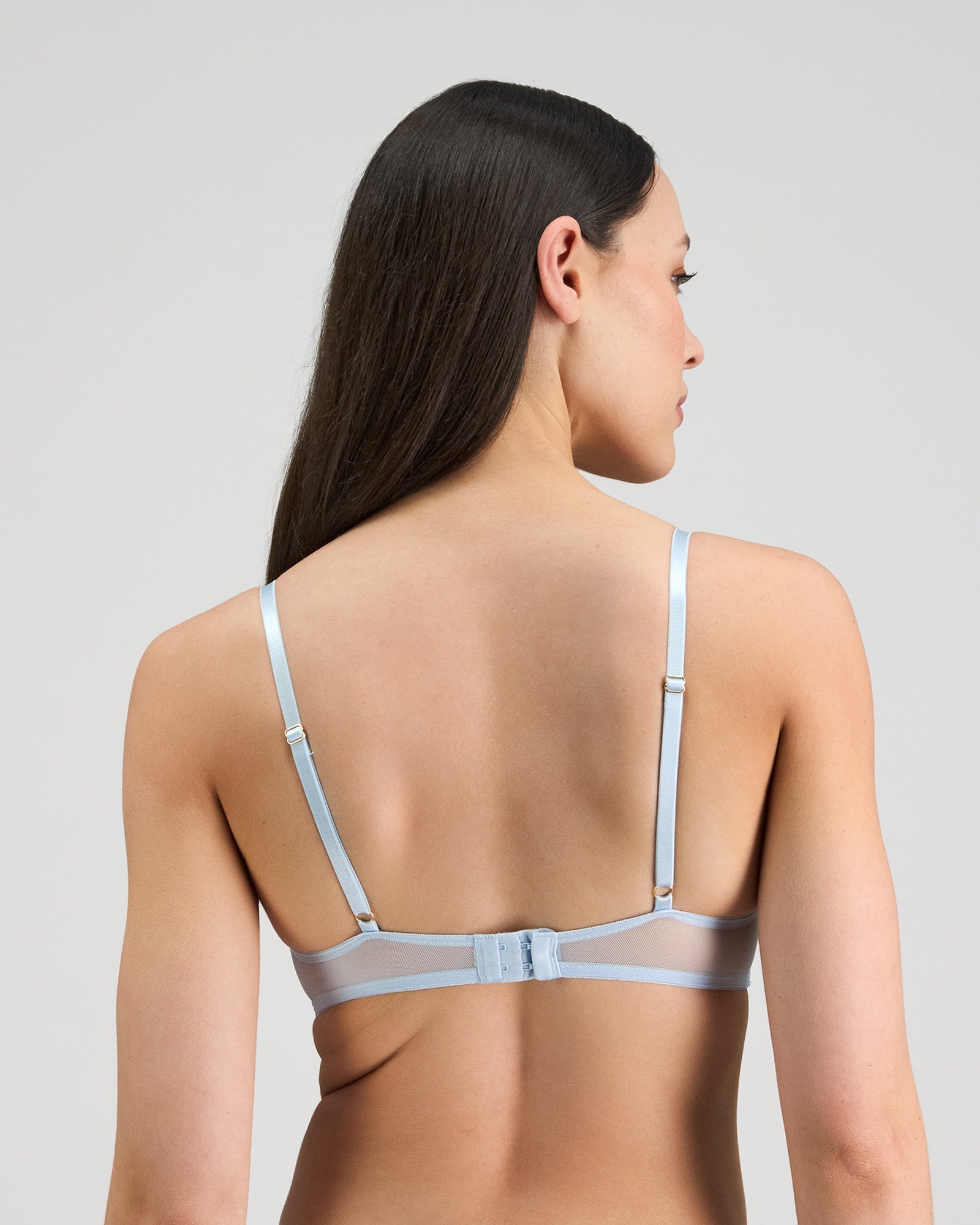 Model wears Jeanie Push Up Bra in OMPHALODES. On body back view
