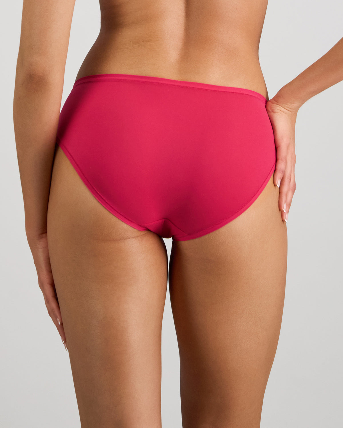 Model wears Extra-Ordinary Bikini in JAZZY. On body back view