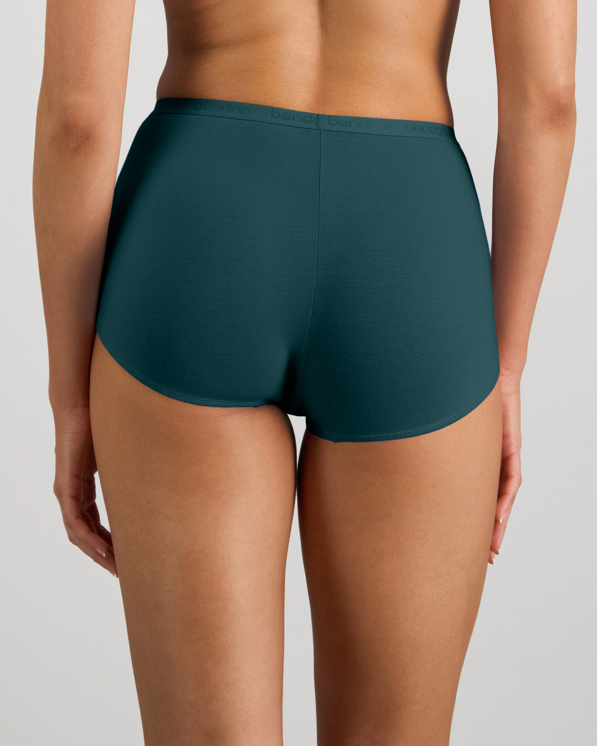 Model wears Body Cotton Full Brief in MEDITERRANEA. On body back view