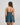 Model wears Ava Rose Babydoll in MEDITERRANEA. On body back view