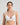Model wears Simply Seamless Wire Free Bra in Basic Wht. On body front view