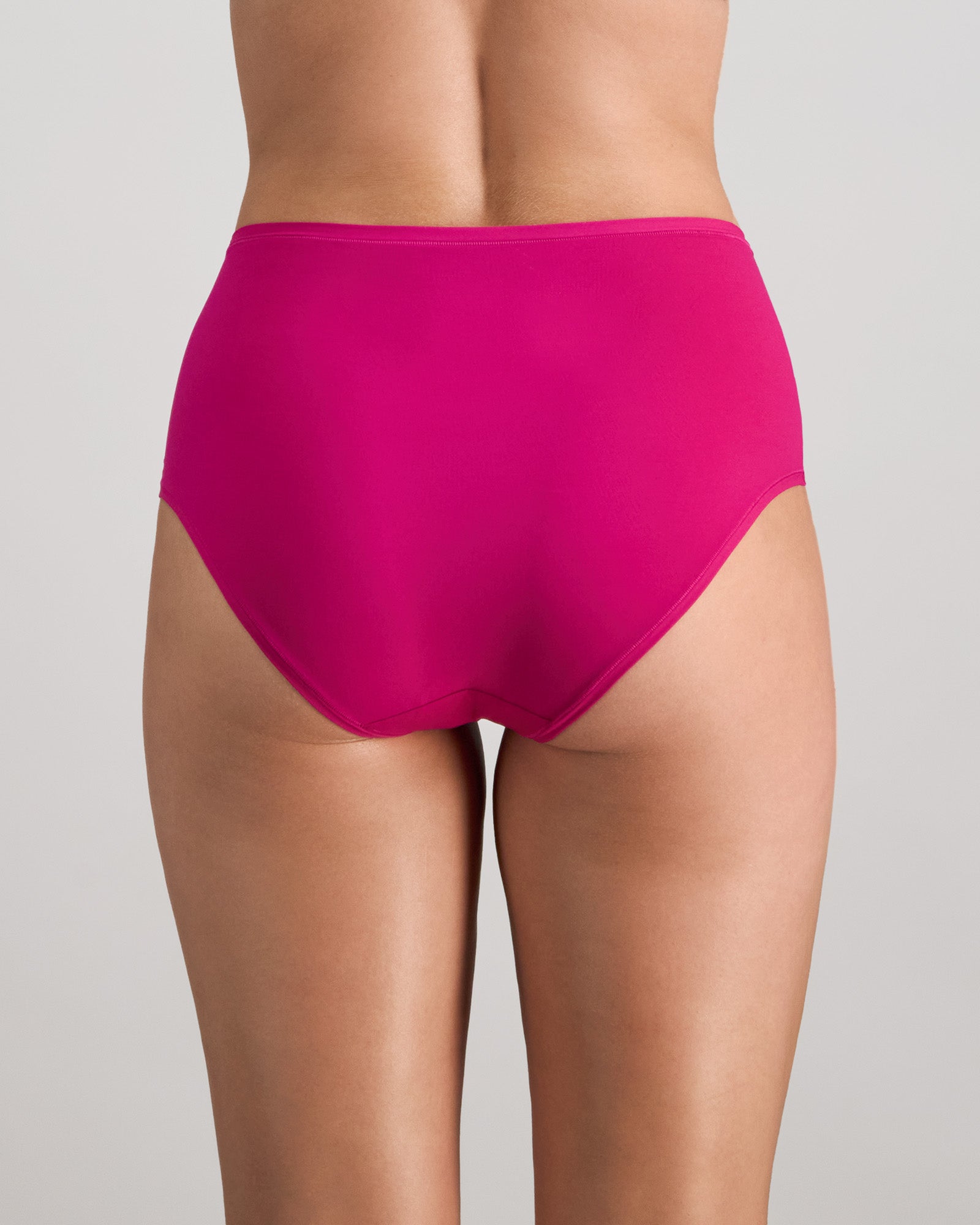 Model wears Extra-Ordinary Full Brief in FANTASY FUCHSIA. On body back view