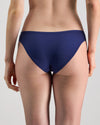 Model wears Extra-Ordinary Bikini Brief in Medieval Blue. On body back view