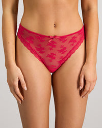 Model wears Light Lace Thong in JAZZY. On body front view