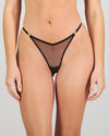 Model wears Sheer Impact Thong in BLACK. On body front view