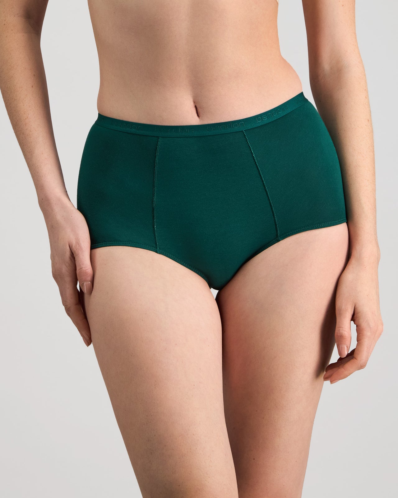 Model wears Body Cotton Full Brief in RAIN FOREST. On body side view