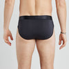 Model wears Bamboo Mens Brief in BLACK. On body back view
