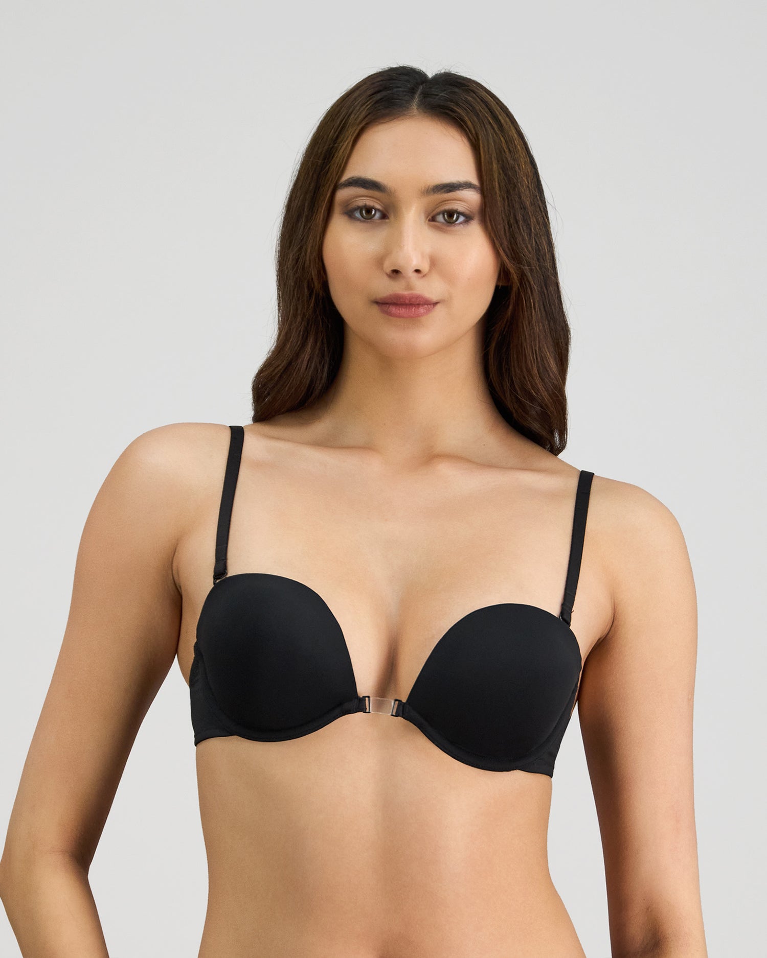 Model wears Infinity Multiway Convertible Bra in BLACK. On body front view