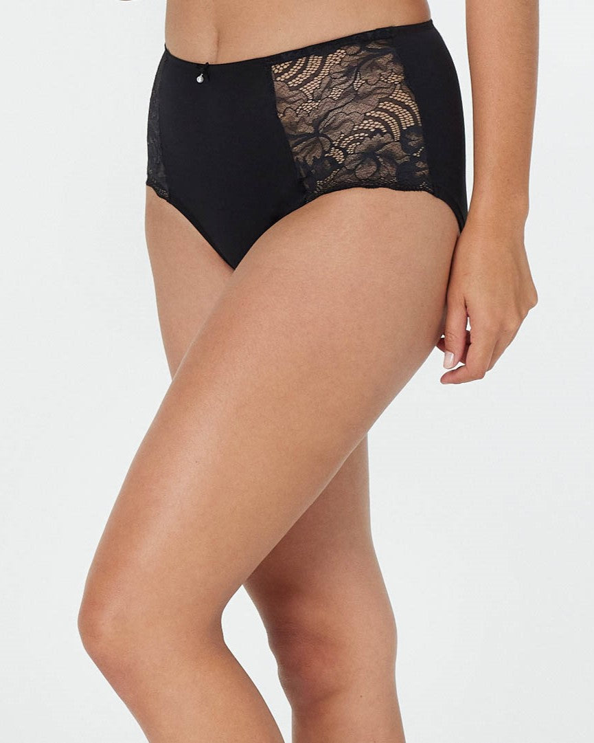 Model wears Embrace Full Brief in BLACK. On body side view