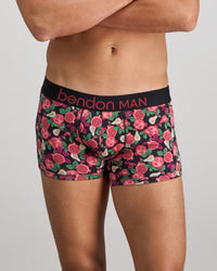 Model wears Retros Print Mens Trunk in SUMMER FRUITS PRINT. On body front view