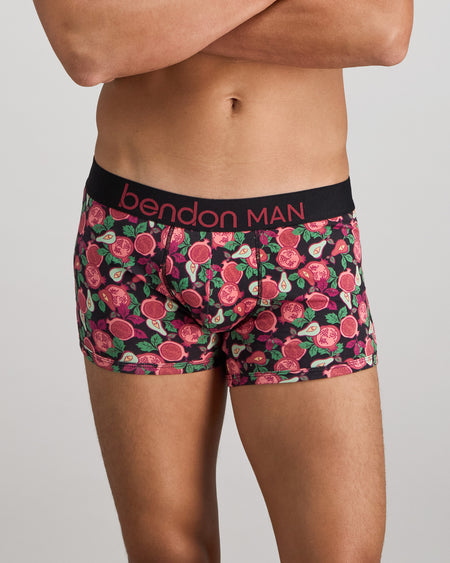 Model wears Retros Print Mens Trunk in SUMMER FRUITS PRINT. On body front view
