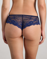 Model wears My Fit Lace Midi in Medieval Blue. On body back view