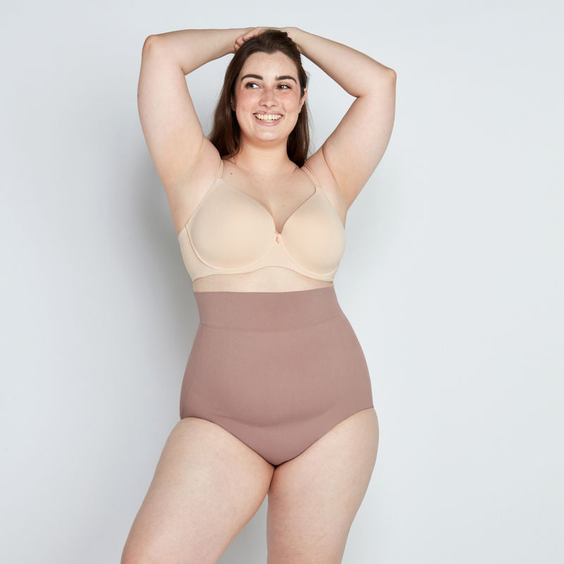 Model wears Medium Control High Waisted Brief in MOCHA. On body front view